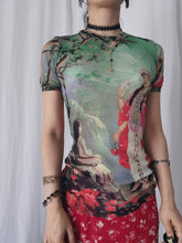 Load image into Gallery viewer, Model wearing vintage Jean Paul Gaultier Maille 90s Shiva print green sheer mesh top